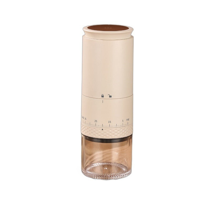 Cream electric coffee grinder with a brown display disc on top and an amber tinted clear cup on a white background
