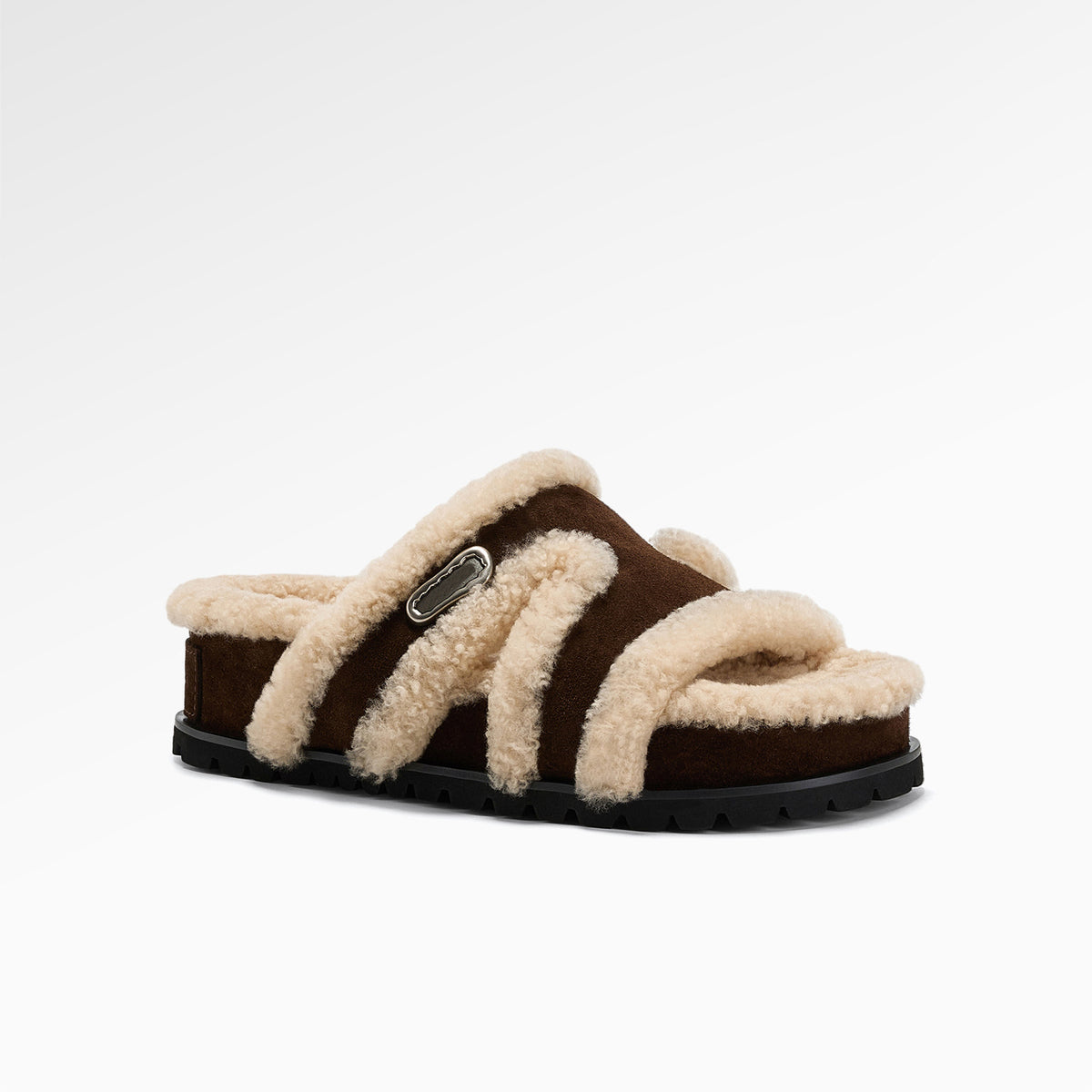 Brown suede fleece lined slipper angled to show the footbed and sole