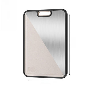 Double-sided cutting board showing titanium metal face and wheat-straw face in a black frame