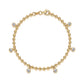 Top down view of the bracelet coiled on a wooden surface