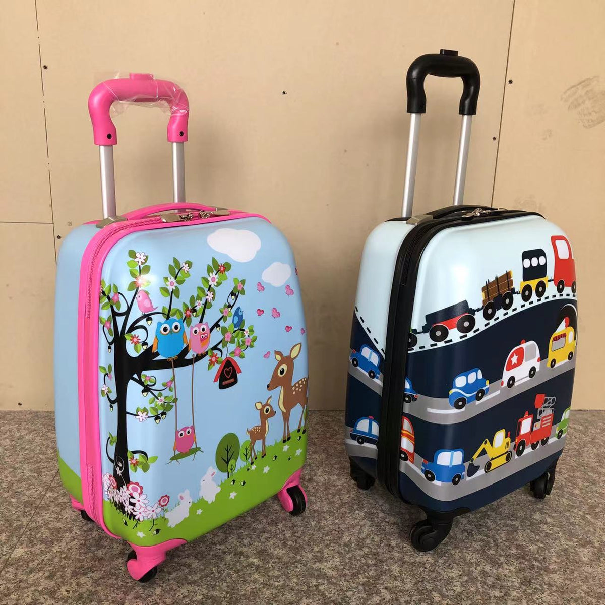 Pink deer print and blue vehicle print kids hardshell luggage pair with spinner wheels