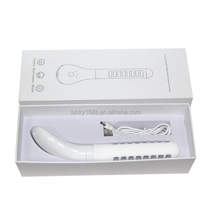 White pelvic floor training device resting in a gift box with a coiled USB charging cable