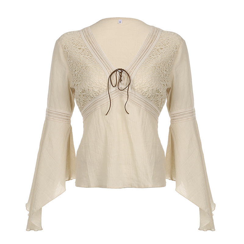 Cream crinkle blouse shot flat and front on, crochet lace panels either side of the V and long bell sleeves