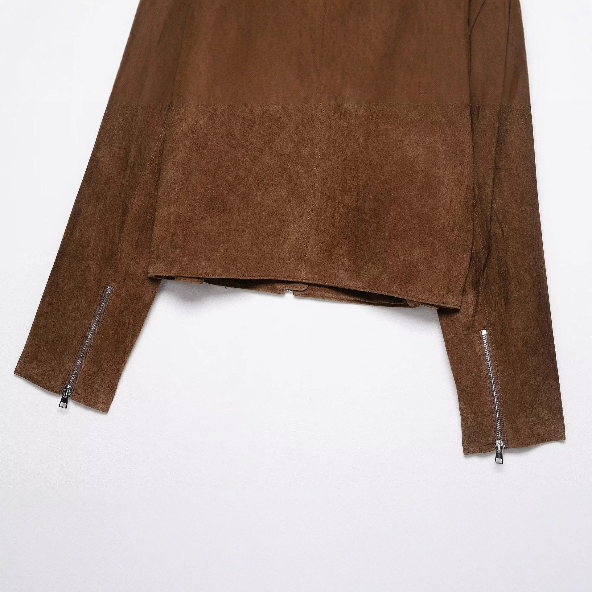 Close view of the vegan suede jacket zip front and chest zip pocket