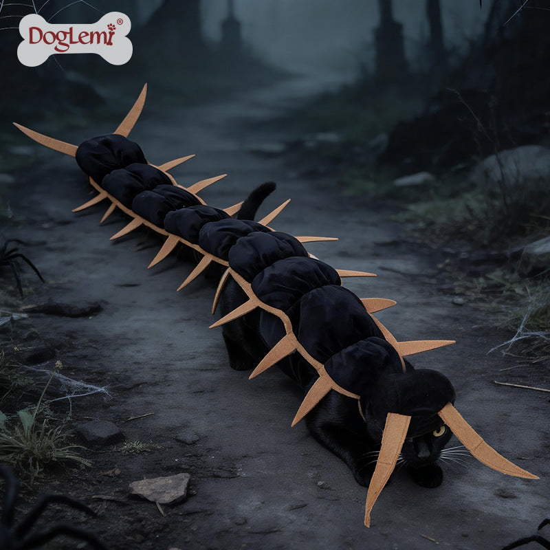 Black cat wearing a segmented centipede Halloween costume with pointed tan legs along its back