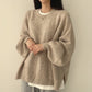 Women's knitted puff sleeve sweater shown on model front view