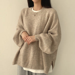 Women's knitted puff sleeve sweater shown on model front view