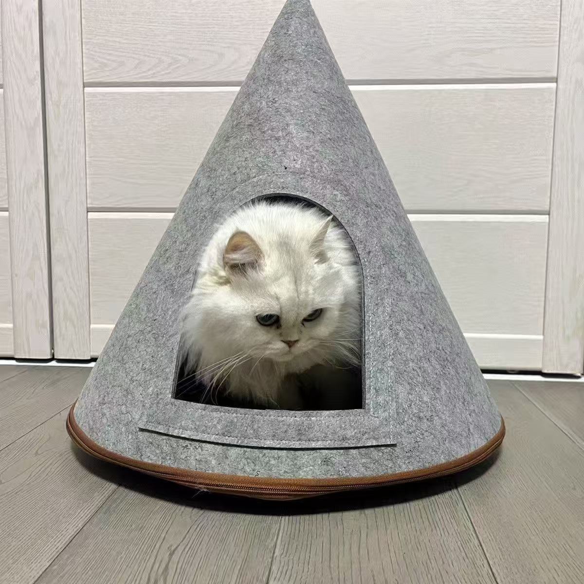 Cat bed with cushion option: grey felt cone shaped cat house with an arched doorway and a white cat inside