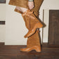 Side view of a brown microfiber mid calf boot showing the low heel and round toe