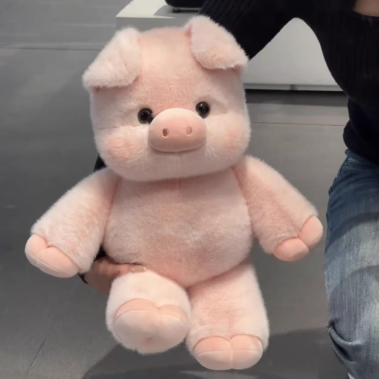 Soft plush animal toys arranged top down showing the color range