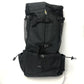 Black Oxford fabric dog carrier backpack showing mesh side vents and buckle straps
