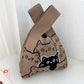 Small knitted handbag with a stretchy body and a wide open top mouth