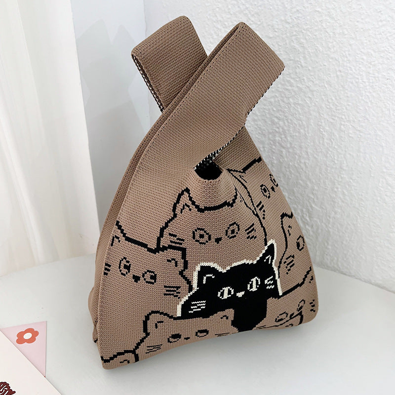 Small knitted handbag with a stretchy body and a wide open top mouth