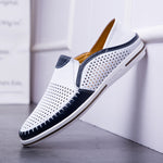Mens leather slip on loafer with a perforated cutout upper and car stitch toe detail