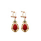 Bohemian tassel and bead clip-on drop earrings, aged tone zinc alloy frame, handmade pair on plain white background