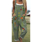 Loose overall jumpsuit worn over a tee, button straps and rolled cuffs