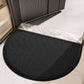 Black semi circular mesh net door mat placed at a sliding door threshold