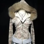 Camouflage zip hoodie with a thick tan vegan fur trimmed hood on a mannequin, styled with cross pendant necklaces