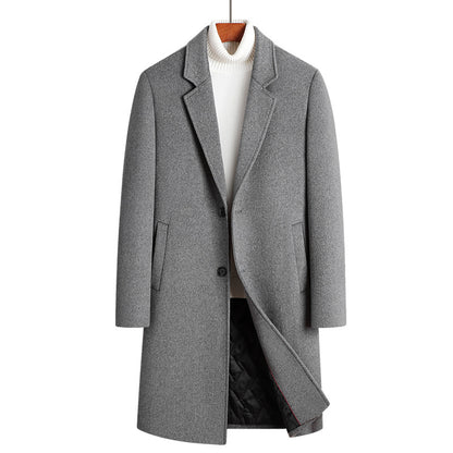 Gray single-breasted long coat with notch lapel on a hanger over a white turtleneck, front view