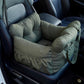 Padded car seat pet bed with raised bolster walls, carry handles and an inner clip empty on a car seat showing the raised b