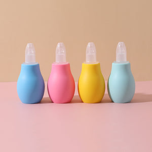 Row of pastel squeeze bulb baby nasal aspirators with clear caps removed beside the soft tips