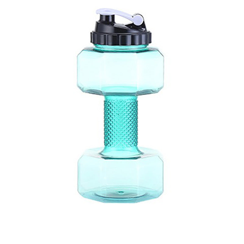 Black capped dumbbell water bottle standing beside its printed capacity chart