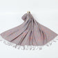 Gray paisley jacquard scarf spread on a white background with twisted gray tassel fringe