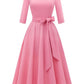 Close up of the swing dress bodice darts, round neck and matching tie belt fabric