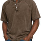 Washed denim henley shown styled over jeans for a weekend look