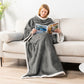 Woman reading on a sofa in a gray sleeved flannel blanket with white sherpa trim, Gray option