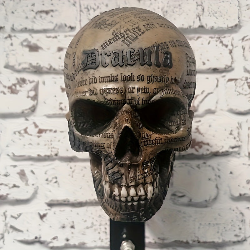 Resin skull helmet rack mounted on a wall holding a motorcycle helmet between rides