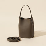Genuine leather bucket bag in soft studio lighting on a plain backdrop