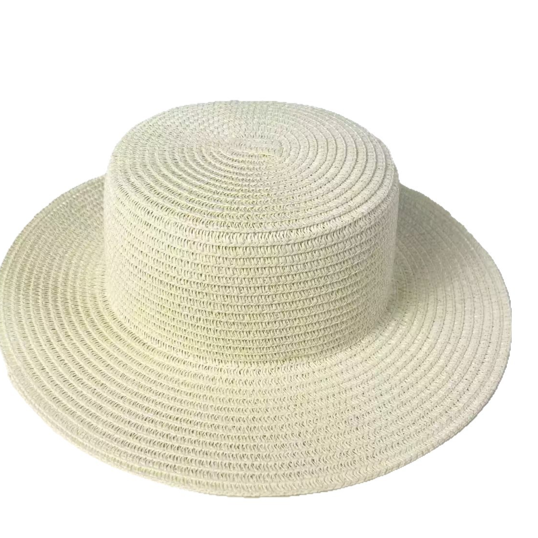 Khaki toned paper straw wide brim sun hat with a flat top crown on a plain background