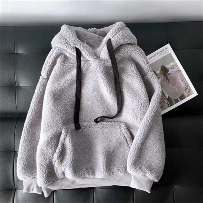 Detail of the soft sherpa pile on a gray women's hooded sweatshirt