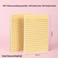 Hand peeling a lined sticky note from a pastel pad to place a quick reminder