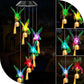 Hummingbird LED figures with golden bells and tassels hanging from a solar lamp head, black housing option