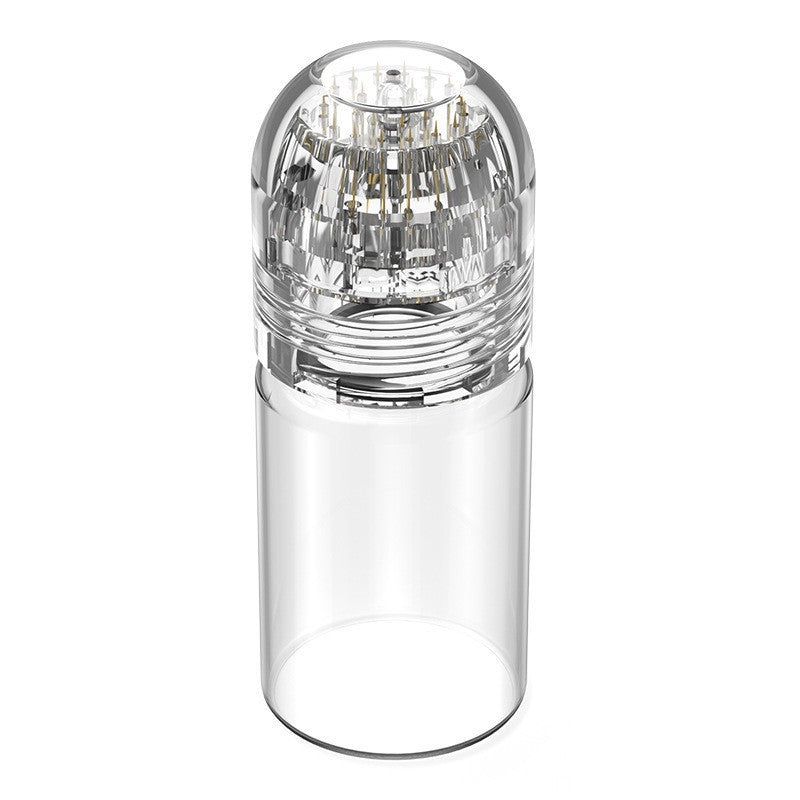 Close up of the clear applicator cap showing the ring of fine gold toned metal micro tips