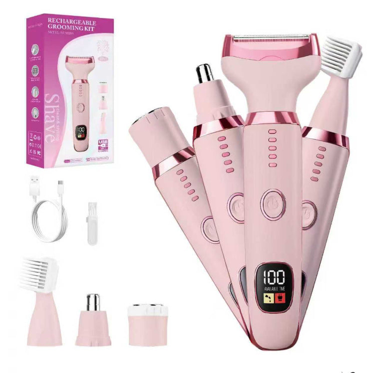 White rechargeable grooming kit handle with a power button and rose gold ring