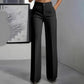 High waist wide leg trousers paired with a fitted top for an evening look