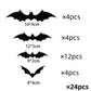 Assorted black 3D bat stickers shown from an angle on a white wall