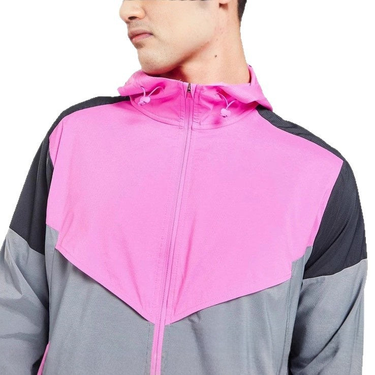 Close view of the zip front and colour block panels of a hooded sports jacket