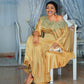 Gold satin flowing maxi dress with a wide lace neckline and long draped sleeves