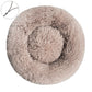 Gray brown round plush pet bed with a raised bolster rim on a plain background