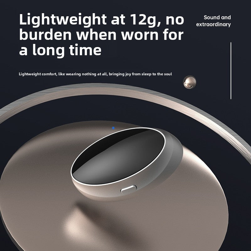 Silver oval throat pulse device with a control button on a dark reflective surface