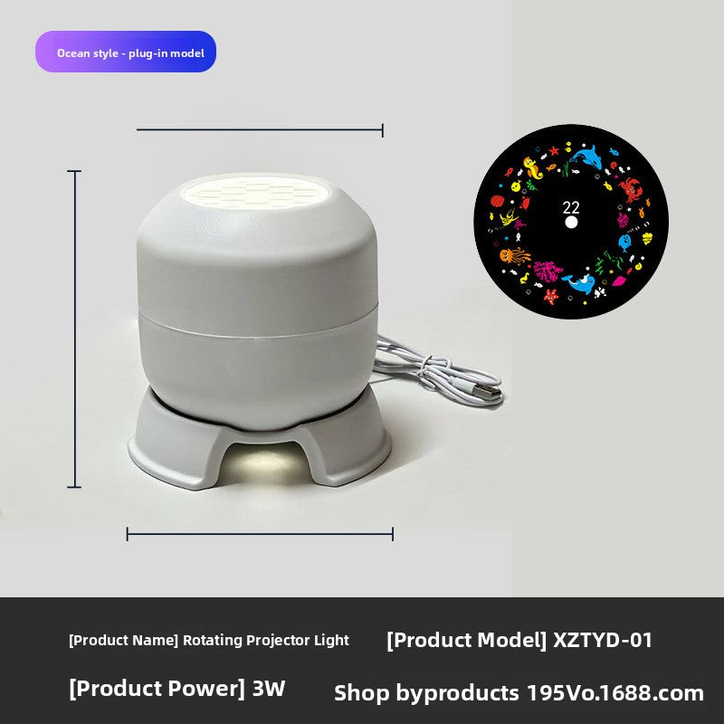Rotating projector light with USB cable and an ocean animals pattern disc, warm glow under the base, plug-in model