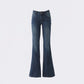 Dark blue vintage wash flared jeans flat lay, front view showing the button fly and slim to flare leg