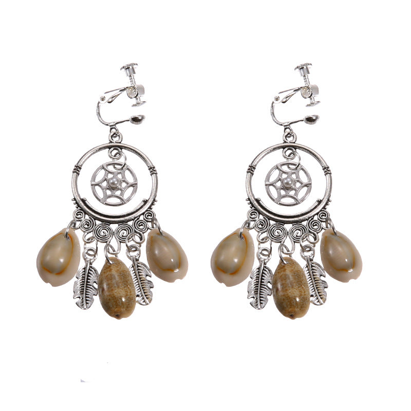 Vintage boho tassel clip-on earrings for non pierced ears, zinc alloy drop pair photographed on white background