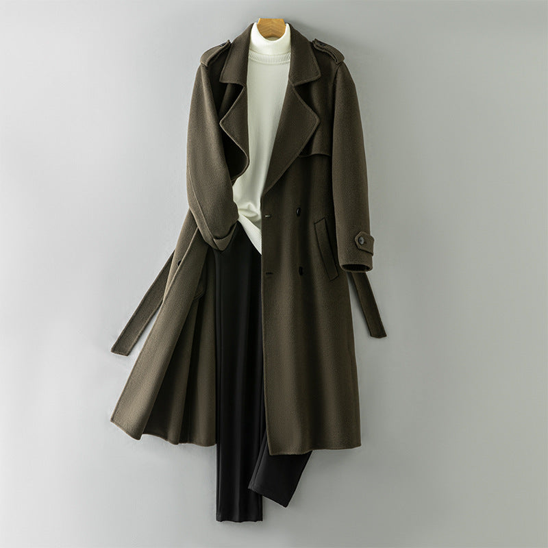 Black wool overcoat side view showing the over the knee length