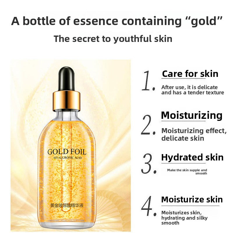 Facial essence bottle with suspended gold flakes and four moisturizing benefit points