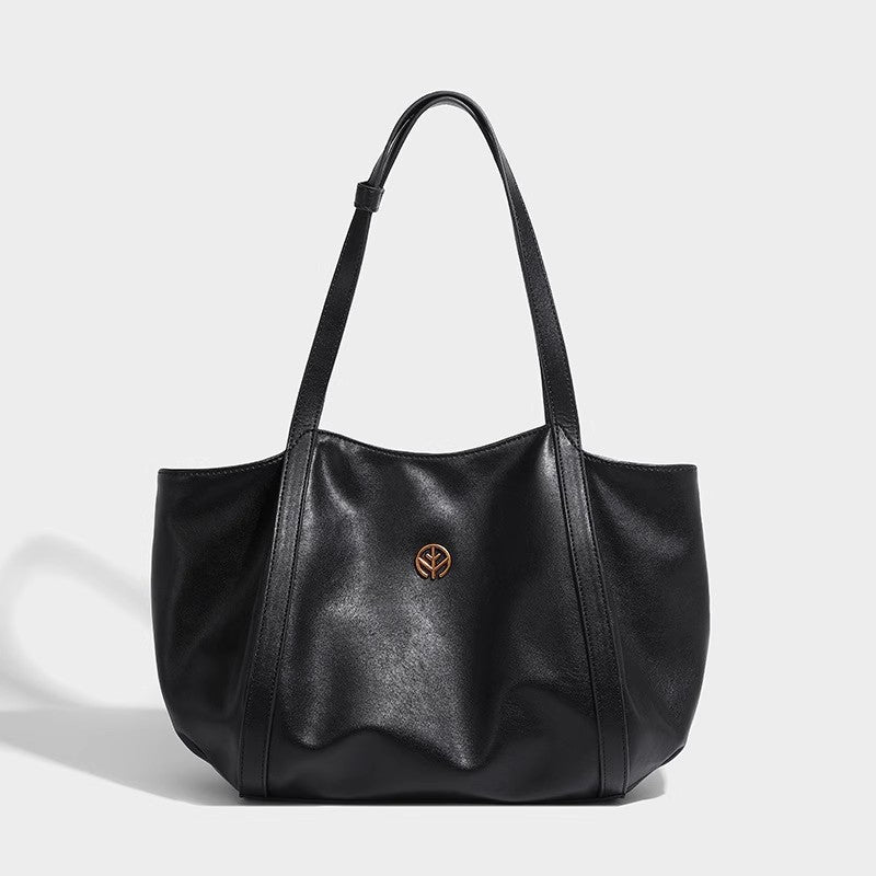 Black smooth faux leather shoulder tote, front view showing structured shape and leaf logo
